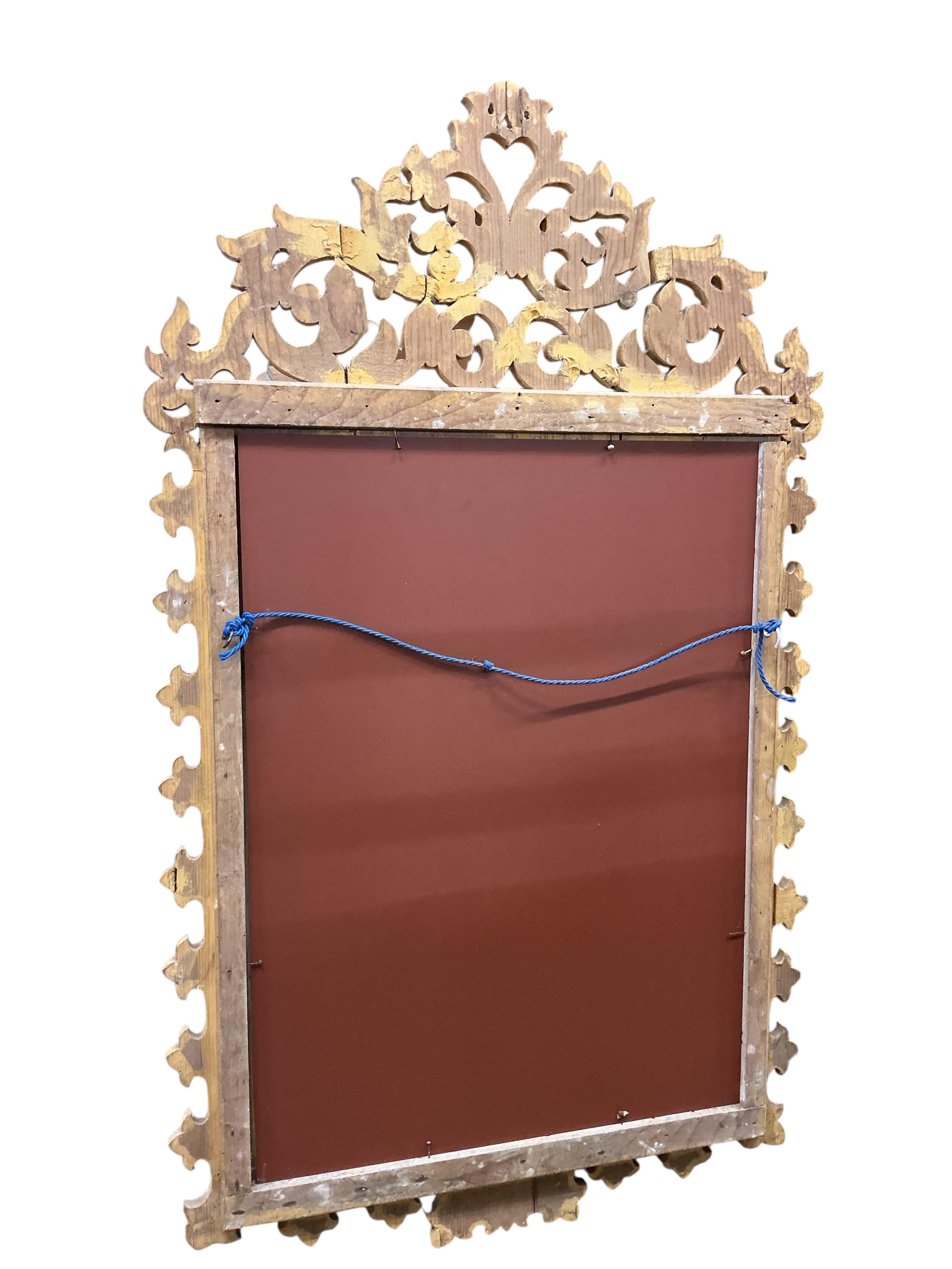 A pair of Italian painted carved giltwood wall mirrors, width 72cm, height 125cm